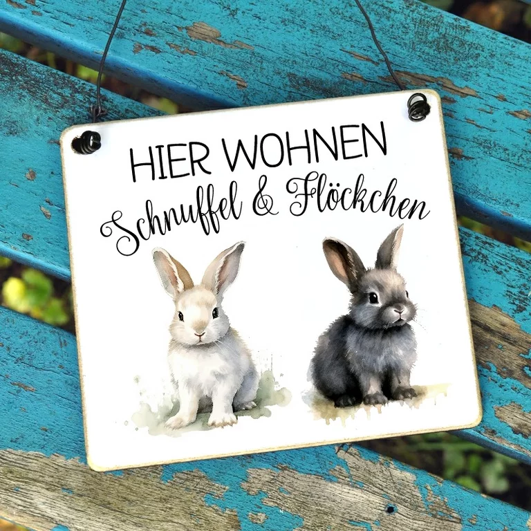 Putziges Hasenschild mit individueller Beschriftung. Hier wohnen...